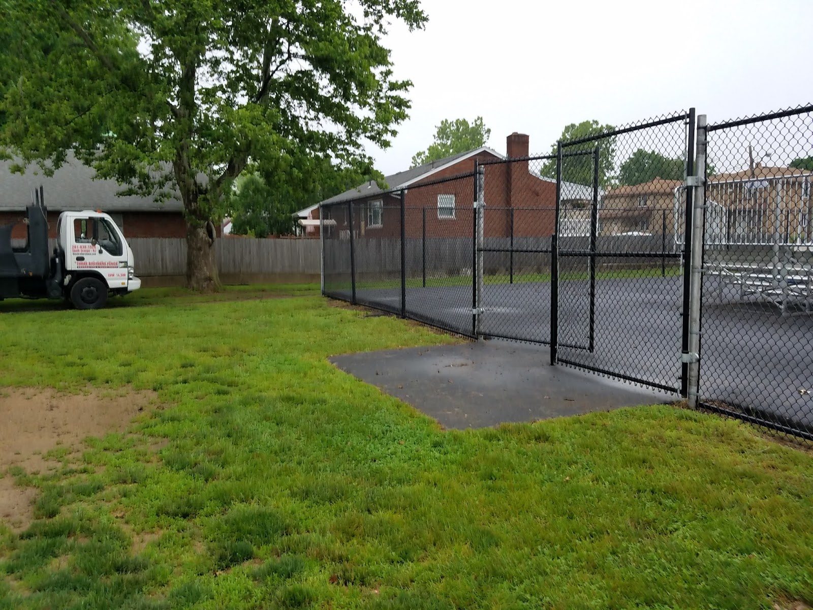 Completed fence installation by the Three Brothers Fence Co. crew